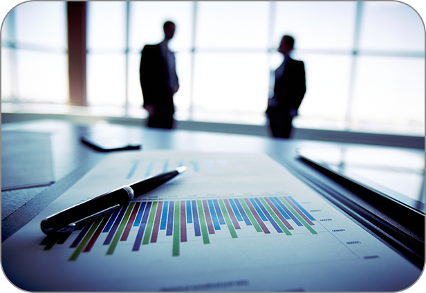 A pen on a graph and 2 people discussing far away. Litigation Consultant