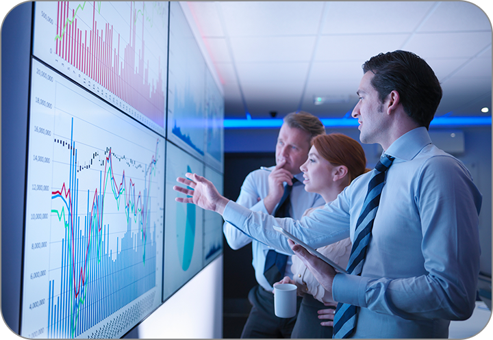 A team of experts looking towards charts and graphs. Consulting Expert Litigation - Courtroom Sciences, Inc.